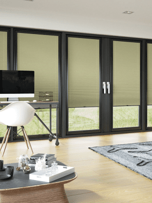 This image shows khaki green pleated bi-fold blinds fitted onto black framed glass doors